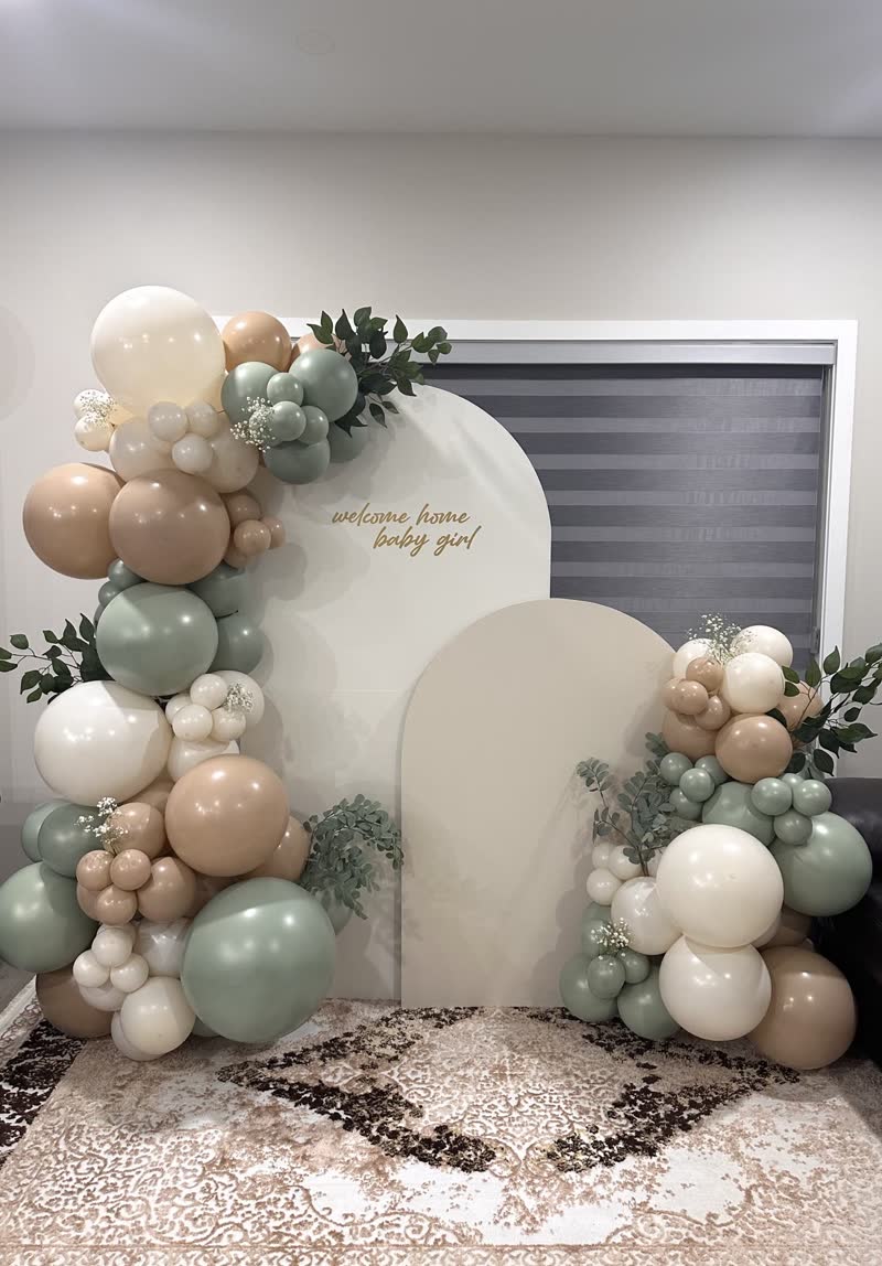 Sage and cream balloon garland with arched backdrop panels, Winnipeg